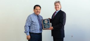 Mingo Resendiz being handed his lifetime achievement award from Jimmy Andreoli Jr