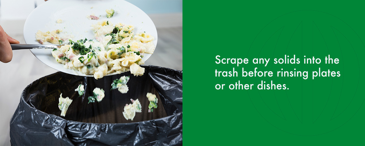 scrape any solids into the trash before rinsing plates or other dishes